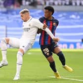 Federico Valverde and Alejandro Balde battle for the ball during the La Liga match between Real Madrid CF and FC Barcelona (Photo by David Ramos/Getty Images)
