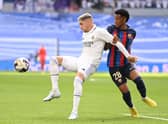 Federico Valverde and Alejandro Balde battle for the ball during the La Liga match between Real Madrid CF and FC Barcelona (Photo by David Ramos/Getty Images)