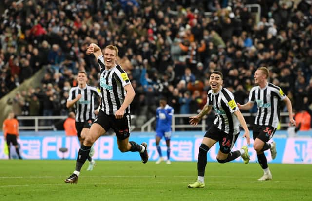 Dan Burn of Newcastle United celebrates with teammates Miguel Almiron and Sean Longstaff after scoring the team’s first goal during the Carabao Cup Quarter Final match between Newcastle United and Leicester City at St James’ Park on January 10, 2023 in Newcastle upon Tyne, England. 