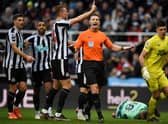 Newcastle players appeal to referee Robert Jones after Fulham’s Serbian striker Aleksandar Mitrovic (unseen) took and scored a penalty, that was later disallowed,  during the English Premier League football match between Newcastle United and Fulham at St James’ Park in Newcastle-upon-Tyne, north-east England on January 15, 2023. - RESTRICTED TO EDITORIAL USE. No use with unauthorized audio, video, data, fixture lists, club/league logos or ‘live’ services. Online in-match use limited to 120 images. An additional 40 images may be used in extra time. No video emulation. Social media in-match use limited to 120 images. An additional 40 images may be used in extra time. No use in betting publications, games or single club/league/player publications. (Photo by Oli SCARFF / AFP) / RESTRICTED TO EDITORIAL USE. No use with unauthorized audio, video, data, fixture lists, club/league logos or ‘live’ services. Online in-match use limited to 120 images. An additional 40 images may be used in extra time. No video emulation. Social media in-match use limited to 120 images. An additional 40 images may be used in extra time. No use in betting publications, games or single club/league/player publications. / RESTRICTED TO EDITORIAL USE. No use with unauthorized audio, video, data, fixture lists, club/league logos or ‘live’ services. Online in-match use limited to 120 images. An additional 40 images may be used in extra time. No video emulation. Social media in-match use limited to 120 images. An additional 40 images may be used in extra time. No use in betting publications, games or single club/league/player publications. (Photo by OLI SCARFF/AFP via Getty Images)