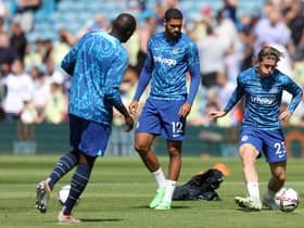 Ruben Loftus-Cheek looks on as Conor Gallagher warms up prior to kick off of the Premier League match between Leeds United and Chelsea FC (Photo by Catherine Ivill/Getty Images)