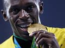 Gold medalist Usain Bolt of Jamaica stands on the podium during the medal ceremony for the Men’s 4 x 100 meter Relay on Day 15 of the Rio 2016 Olympic Games at the Olympic Stadium on August 20, 2016 in Rio de Janeiro, Brazil.  (Photo by Patrick Smith/Getty Images)