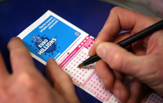 A punter fills out a EuroMillions ticket in London.  (Photo by Peter Macdiarmid/Getty Images)