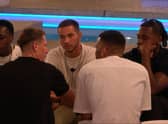 The male islanders talking about the game, just before the drama erupted. (Photo by ITV)