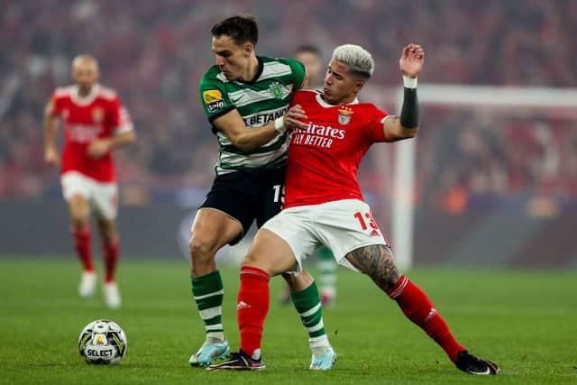 Enzo Fernandez (R) vies with Sporting's Uruguayan midfielder Manuel Ugarte during the Portuguese League football match between SL Benfica and Sporting CP 