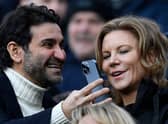 Newcastle United's owners Amanda Staveley (R) looks at her husband Mehrdad Ghodoussi's phone, ahead of the English Premier League football match between Newcastle United and Fulham at St James' Park in Newcastle-upon-Tyne, north-east England on January 15, 2023. - RESTRICTED TO EDITORIAL USE. No use with unauthorized audio, video, data, fixture lists, club/league logos or 'live' services. Online in-match use limited to 120 images. An additional 40 images may be used in extra time. No video emulation. Social media in-match use limited to 120 images. An additional 40 images may be used in extra time. No use in betting publications, games or single club/league/player publications. (Photo by Oli SCARFF / AFP) / RESTRICTED TO EDITORIAL USE. No use with unauthorized audio, video, data, fixture lists, club/league logos or 'live' services. Online in-match use limited to 120 images. An additional 40 images may be used in extra time. No video emulation. Social media in-match use limited to 120 images. An additional 40 images may be used in extra time. No use in betting publications, games or single club/league/player publications. / RESTRICTED TO EDITORIAL USE. No use with unauthorized audio, video, data, fixture lists, club/league logos or 'live' services. Online in-match use limited to 120 images. An additional 40 images may be used in extra time. No video emulation. Social media in-match use limited to 120 images. An additional 40 images may be used in extra time. No use in betting publications, games or single club/league/player publications. (Photo by OLI SCARFF/AFP via Getty Images)