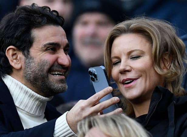Newcastle United's owners Amanda Staveley (R) looks at her husband Mehrdad Ghodoussi's phone, ahead of the English Premier League football match between Newcastle United and Fulham at St James' Park in Newcastle-upon-Tyne, north-east England on January 15, 2023. - RESTRICTED TO EDITORIAL USE. No use with unauthorized audio, video, data, fixture lists, club/league logos or 'live' services. Online in-match use limited to 120 images. An additional 40 images may be used in extra time. No video emulation. Social media in-match use limited to 120 images. An additional 40 images may be used in extra time. No use in betting publications, games or single club/league/player publications. (Photo by Oli SCARFF / AFP) / RESTRICTED TO EDITORIAL USE. No use with unauthorized audio, video, data, fixture lists, club/league logos or 'live' services. Online in-match use limited to 120 images. An additional 40 images may be used in extra time. No video emulation. Social media in-match use limited to 120 images. An additional 40 images may be used in extra time. No use in betting publications, games or single club/league/player publications. / RESTRICTED TO EDITORIAL USE. No use with unauthorized audio, video, data, fixture lists, club/league logos or 'live' services. Online in-match use limited to 120 images. An additional 40 images may be used in extra time. No video emulation. Social media in-match use limited to 120 images. An additional 40 images may be used in extra time. No use in betting publications, games or single club/league/player publications. (Photo by OLI SCARFF/AFP via Getty Images)