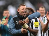 NEWCASTLE UPON TYNE, ENGLAND - JANUARY 31: Newcastle coach Graeme Jones celebrates with Allan Saint-Maximin after the Carabao Cup Semi Final 2nd Leg match between Newcastle United and Southampton at St James’ Park on January 31, 2023 in Newcastle upon Tyne, England. (Photo by Stu Forster/Getty Images)