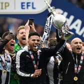 Newcastle United players Jamaal Lascelles (l) and Jonjo Shelvey lift the trophy after winning the Sky Bet Championship title after the match between Newcastle United and Barnsley at St James' Park on May 7, 2017 in Newcastle upon Tyne, England.  (Photo by Stu Forster/Getty Images)