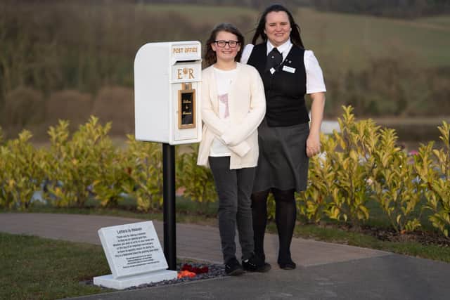 Matilda Handy, 9, and mum, Leanne Handy 45 with their letter box to heaven, in Gedling Crematorium, which allows grieving members of the public to write a letter to their loved ones who have passed away. (Picture by SWNS)