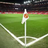 A Manchester United flag is pictured on the corner of the pitch prior to the start of the English Premier League football match between Manchester United and Leeds United at Old Trafford in Manchester, north west England, on February  8, 2023. - RESTRICTED TO EDITORIAL USE. No use with unauthorized audio, video, data, fixture lists, club/league logos or 'live' services. Online in-match use limited to 120 images. An additional 40 images may be used in extra time. No video emulation. Social media in-match use limited to 120 images. An additional 40 images may be used in extra time. No use in betting publications, games or single club/league/player publications. (Photo by Oli SCARFF / AFP) / RESTRICTED TO EDITORIAL USE. No use with unauthorized audio, video, data, fixture lists, club/league logos or 'live' services. Online in-match use limited to 120 images. An additional 40 images may be used in extra time. No video emulation. Social media in-match use limited to 120 images. An additional 40 images may be used in extra time. No use in betting publications, games or single club/league/player publications. / RESTRICTED TO EDITORIAL USE. No use with unauthorized audio, video, data, fixture lists, club/league logos or 'live' services. Online in-match use limited to 120 images. An additional 40 images may be used in extra time. No video emulation. Social media in-match use limited to 120 images. An additional 40 images may be used in extra time. No use in betting publications, games or single club/league/player publications. (Photo by OLI SCARFF/AFP via Getty Images)