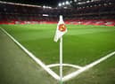 A Manchester United flag is pictured on the corner of the pitch prior to the start of the English Premier League football match between Manchester United and Leeds United at Old Trafford in Manchester, north west England, on February  8, 2023. - RESTRICTED TO EDITORIAL USE. No use with unauthorized audio, video, data, fixture lists, club/league logos or 'live' services. Online in-match use limited to 120 images. An additional 40 images may be used in extra time. No video emulation. Social media in-match use limited to 120 images. An additional 40 images may be used in extra time. No use in betting publications, games or single club/league/player publications. (Photo by Oli SCARFF / AFP) / RESTRICTED TO EDITORIAL USE. No use with unauthorized audio, video, data, fixture lists, club/league logos or 'live' services. Online in-match use limited to 120 images. An additional 40 images may be used in extra time. No video emulation. Social media in-match use limited to 120 images. An additional 40 images may be used in extra time. No use in betting publications, games or single club/league/player publications. / RESTRICTED TO EDITORIAL USE. No use with unauthorized audio, video, data, fixture lists, club/league logos or 'live' services. Online in-match use limited to 120 images. An additional 40 images may be used in extra time. No video emulation. Social media in-match use limited to 120 images. An additional 40 images may be used in extra time. No use in betting publications, games or single club/league/player publications. (Photo by OLI SCARFF/AFP via Getty Images)