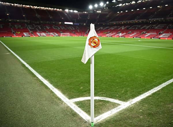 A Manchester United flag is pictured on the corner of the pitch prior to the start of the English Premier League football match between Manchester United and Leeds United at Old Trafford in Manchester, north west England, on February  8, 2023. - RESTRICTED TO EDITORIAL USE. No use with unauthorized audio, video, data, fixture lists, club/league logos or 'live' services. Online in-match use limited to 120 images. An additional 40 images may be used in extra time. No video emulation. Social media in-match use limited to 120 images. An additional 40 images may be used in extra time. No use in betting publications, games or single club/league/player publications. (Photo by Oli SCARFF / AFP) / RESTRICTED TO EDITORIAL USE. No use with unauthorized audio, video, data, fixture lists, club/league logos or 'live' services. Online in-match use limited to 120 images. An additional 40 images may be used in extra time. No video emulation. Social media in-match use limited to 120 images. An additional 40 images may be used in extra time. No use in betting publications, games or single club/league/player publications. / RESTRICTED TO EDITORIAL USE. No use with unauthorized audio, video, data, fixture lists, club/league logos or 'live' services. Online in-match use limited to 120 images. An additional 40 images may be used in extra time. No video emulation. Social media in-match use limited to 120 images. An additional 40 images may be used in extra time. No use in betting publications, games or single club/league/player publications. (Photo by OLI SCARFF/AFP via Getty Images)