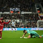 Liverpool's Egyptian striker Mohamed Salah (L) fights for the ball with Newcastle United's English goalkeeper Nick Pope (R) during the English Premier League football match between Newcastle United and Liverpool at St James' Park in Newcastle-upon-Tyne, north east England on February 18, 2023. - RESTRICTED TO EDITORIAL USE. No use with unauthorized audio, video, data, fixture lists, club/league logos or 'live' services. Online in-match use limited to 120 images. An additional 40 images may be used in extra time. No video emulation. Social media in-match use limited to 120 images. An additional 40 images may be used in extra time. No use in betting publications, games or single club/league/player publications. (Photo by Oli SCARFF / AFP) / RESTRICTED TO EDITORIAL USE. No use with unauthorized audio, video, data, fixture lists, club/league logos or 'live' services. Online in-match use limited to 120 images. An additional 40 images may be used in extra time. No video emulation. Social media in-match use limited to 120 images. An additional 40 images may be used in extra time. No use in betting publications, games or single club/league/player publications. / RESTRICTED TO EDITORIAL USE. No use with unauthorized audio, video, data, fixture lists, club/league logos or 'live' services. Online in-match use limited to 120 images. An additional 40 images may be used in extra time. No video emulation. Social media in-match use limited to 120 images. An additional 40 images may be used in extra time. No use in betting publications, games or single club/league/player publications. (Photo by OLI SCARFF/AFP via Getty Images)