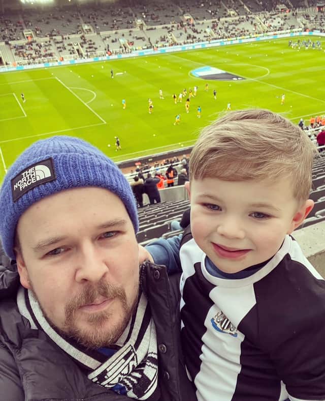 Dan and his son at a game