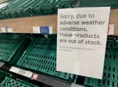 Empty shelves are seen in the fruit and vegetable aisles of a Tesco supermarket on February 22 in Burgess Hill.