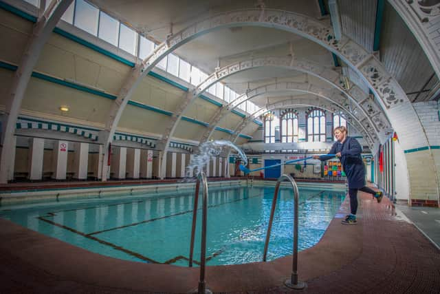 Stephanie Jones Duty Manager cleaning The Moseley Road Baths after renovation