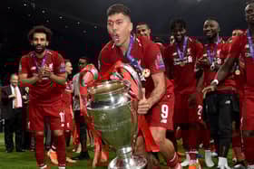 Roberto Firmino of Liverpool lifting the UEFA Champions League trophy at the end of the UEFA Champions League Final between Tottenham Hotspur and Liverpool at Estadio Wanda Metropolitano on June 01, 2019 in Madrid, Spain. (Photo by John Powell/Liverpool FC via Getty Images)