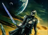 A promotional image for The Mandalorian S3, depicting Pedro Pascal as Din Djarin in front of a yellow and green sky (Credit: Disney+)