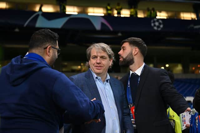 Chelsea’s US owner Todd Boehly (R) reacts after the UEFA Champions League round of 16 second-leg football match (Photo by GLYN KIRK/IKIMAGES/AFP via Getty Images)