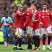 Casemiro of Manchester United is consoled by teammate Antony  after being shown a red card.  (Photo by Nathan Stirk/Getty Images)
