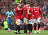 Casemiro of Manchester United is consoled by teammate Antony  after being shown a red card.  (Photo by Nathan Stirk/Getty Images)
