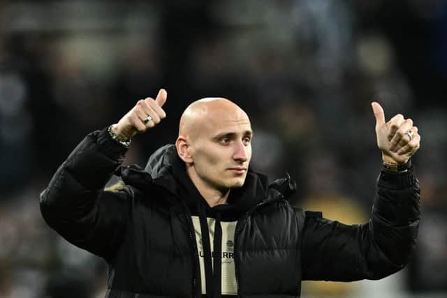 English midfielder Jonjo Shelvey salutes Newcastle United's fans as he prepares to leave the club for Nottingham Forest, during the English League Cup semi final football match between Newcastle United and Southampton at St James's Park stadium in Newcastle, on January 31, 2023. (Photo by Paul ELLIS / AFP) / RESTRICTED TO EDITORIAL USE. No use with unauthorized audio, video, data, fixture lists, club/league logos or 'live' services. Online in-match use limited to 120 images. An additional 40 images may be used in extra time. No video emulation. Social media in-match use limited to 120 images. An additional 40 images may be used in extra time. No use in betting publications, games or single club/league/player publications. / (Photo by PAUL ELLIS/AFP via Getty Images)