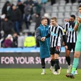NEWCASTLE UPON TYNE, ENGLAND - DECEMBER 17: Kieran Trippier, Matt Targett and Jamaal Lascelles of Newcastle United share a joke after the friendly match between Newcastle United and Rayo Vallecano at St James' Park on December 17, 2022 in Newcastle upon Tyne, England. (Photo by Stu Forster/Getty Images)