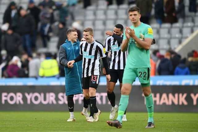 NEWCASTLE UPON TYNE, ENGLAND - DECEMBER 17: Kieran Trippier, Matt Targett and Jamaal Lascelles of Newcastle United share a joke after the friendly match between Newcastle United and Rayo Vallecano at St James' Park on December 17, 2022 in Newcastle upon Tyne, England. (Photo by Stu Forster/Getty Images)