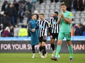 NEWCASTLE UPON TYNE, ENGLAND - DECEMBER 17: Kieran Trippier, Matt Targett and Jamaal Lascelles of Newcastle United share a joke after the friendly match between Newcastle United and Rayo Vallecano at St James' Park on December 17, 2022 in Newcastle upon Tyne, England. (Photo by Stu Forster/Getty Images)