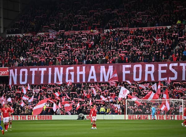 Nottingham Forest fans sing Mull of Kintyre ahead of kick-off in the English Premier League football match between Nottingham Forest and Everton at The City Ground in Nottingham, central England, on March 5, 2023. (Photo by Oli SCARFF / AFP)