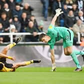 Raul Jimenez of Wolverhampton Wanderers and Nick Pope of Newcastle United collide during the Premier League match between Newcastle United and Wolverhampton Wanderers at St. James Park on March 12, 2023 in Newcastle upon Tyne, England. (Photo by Michael Regan/Getty Images)