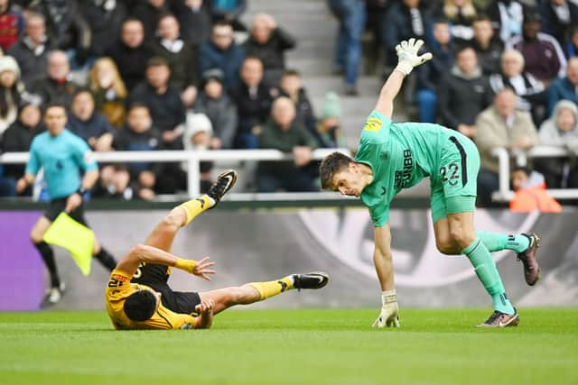 Raul Jimenez of Wolverhampton Wanderers and Nick Pope of Newcastle United collide during the Premier League match between Newcastle United and Wolverhampton Wanderers at St. James Park on March 12, 2023 in Newcastle upon Tyne, England. (Photo by Michael Regan/Getty Images)