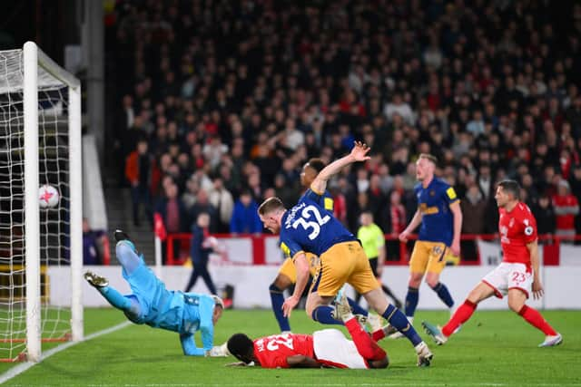 Elliot Anderson of Newcastle United scores the team's second goal past Keylor Navas of Nottingham Forest which is later disallowed by VARduring the Premier League match between Nottingham Forest and Newcastle United at City Ground on March 17, 2023 in Nottingham, England. (Photo by Laurence Griffiths/Getty Images)