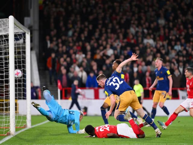 Elliot Anderson of Newcastle United scores the team's second goal past Keylor Navas of Nottingham Forest which is later disallowed by VARduring the Premier League match between Nottingham Forest and Newcastle United at City Ground on March 17, 2023 in Nottingham, England. (Photo by Laurence Griffiths/Getty Images)
