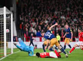 Elliot Anderson of Newcastle United scores the team's second goal past Keylor Navas of Nottingham Forest which is later disallowed by VARduring the Premier League match between Nottingham Forest and Newcastle United at City Ground on March 17, 2023 in Nottingham, England. (Photo by Laurence Griffiths/Getty Images)