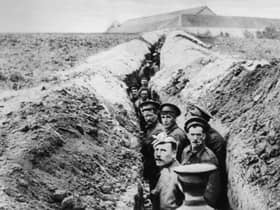 28th October 1914:  British soldiers lined up in a narrow trench during World War I.  (Photo by Hulton Archive/Getty Images)