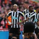 Newcastle United’s English head coach Eddie Howe (L) speaks with his players during a break in play during the English League Cup final football match between Manchester United and Newcastle United at Wembley Stadium, north-west London on February 26, 2023. (Photo by ADRIAN DENNIS / AFP)
