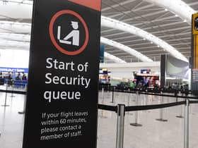 A sign indicating the start of the security queue during a strike by security workers at London Heathrow Airport in London, UK, on Friday, March 31, 2023. IAG SAsÂ British AirwaysÂ is set to scrap 320 flights during the Easter week as security workers strike for 10-days over pay. Photographer: Chris Ratcliffe/Bloomberg via Getty Images