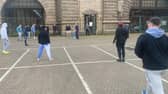 The cricketers passing the time at Dover with an impromptu match (Photo: SWNS)