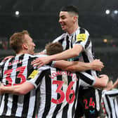 ean Longstaff of Newcastle United (obscured) celebrates with teammates Dan Burn and Miguel Almiron after scoring the team's second goal during the Carabao Cup Semi Final 2nd Leg match between Newcastle United and Southampton at St James' Park on January 31, 2023 in Newcastle upon Tyne, England. (Photo by Stu Forster/Getty Images)