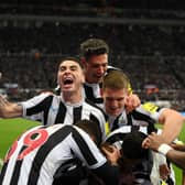 Miguel Almiron of Newcastle United celebrates after teammate Dan Burn of Newcastle United (hidden) scored the team's first goal during the Carabao Cup Quarter Final match between Newcastle United and Leicester City at St James' Park on January 10, 2023 in Newcastle upon Tyne, England. (Photo by Stu Forster/Getty Images)
