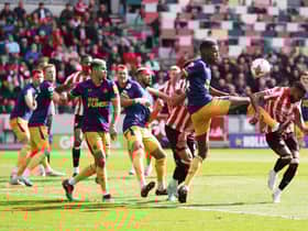 Aexander Isak of Newcastle United fouls Rico Henry of Brentford, which later resulted in a penalty for Brentford during the Premier League match between Brentford FC and Newcastle United at Brentford Community Stadium on April 08, 2023 in Brentford, England. (Photo by Alex Pantling/Getty Images)