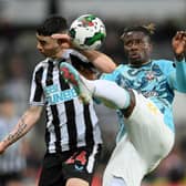 Southampton defender Mohammed Salisu (right) and Newcastle United winger Miguel Almiron (left).  (Photo by Stu Forster/Getty Images)