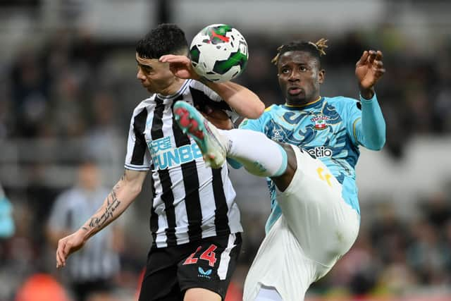 Southampton defender Mohammed Salisu (right) and Newcastle United winger Miguel Almiron (left).  (Photo by Stu Forster/Getty Images)