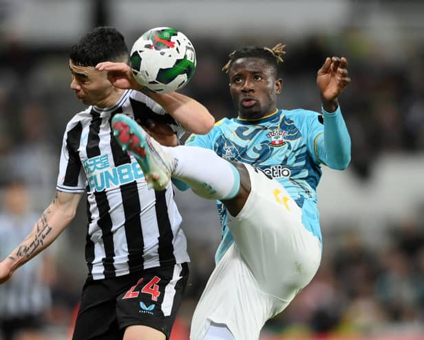 Southampton defender Mohammed Salisu (right) and Newcastle United winger Miguel Almiron (left).  (Photo by Stu Forster/Getty Images)
