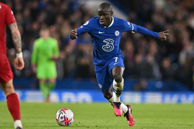 Chelsea’s French midfielder N’Golo Kante runs with the ball during the English Premier League football match (Photo by GLYN KIRK/AFP via Getty Images)