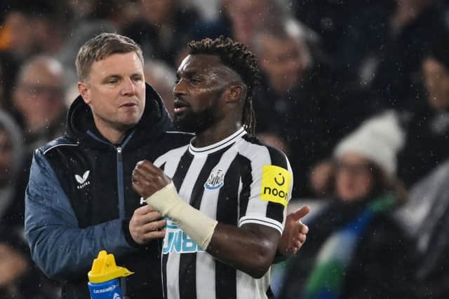 Newcastle United head coach Eddie Howe (left) and winger Allan Saint-Maximin (right). (Photo by JUSTIN TALLIS/AFP via Getty Images)