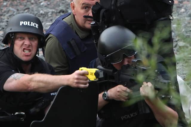 JULY 09: Police negotiate with a man fitting the description of fugitive gunman Raoul Moat on July 9, 2010 in Rothbury, England.