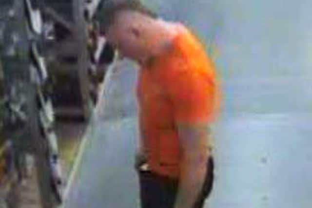 JULY 2: In this handout image released by the Northumbrian Police, A CCTV image shows fugitive 37 years old Raoul Moat in a Newcastle shop on Friday, July 2 revealing he was wearing an orange t-shirt, dark coloured jeans and white trainers on July 2, 2010 in Newcastle-Upon-Tyne,